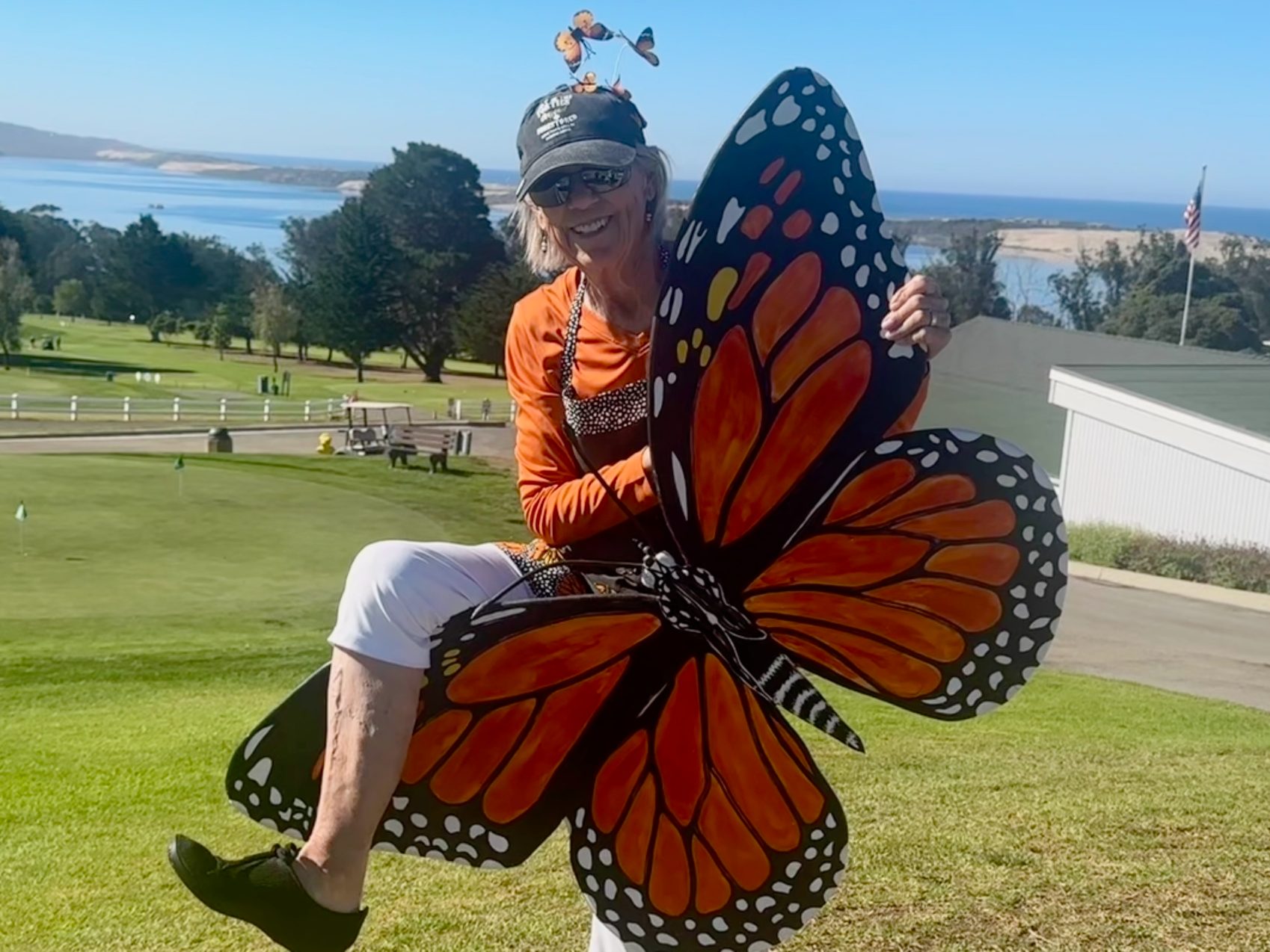Tournament organizer Carolyn Shank embraces the Monarch Invitational spirit — with Morro Bay providing the perfect backdrop.